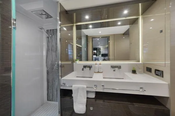 Slide: The Image of Luxurious 2018 Cruisers Cantius yacht bathroom with dual sinks and modern shower. - 13