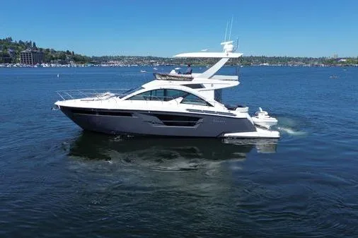 Slide: The Image of 2018 Cruisers Cantius yacht cruising on a sunny lake with clear blue skies. - 17