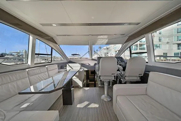 Slide: The Image of Luxurious interior of 2018 Cruisers Cantius yacht with modern seating and panoramic windows. - 4