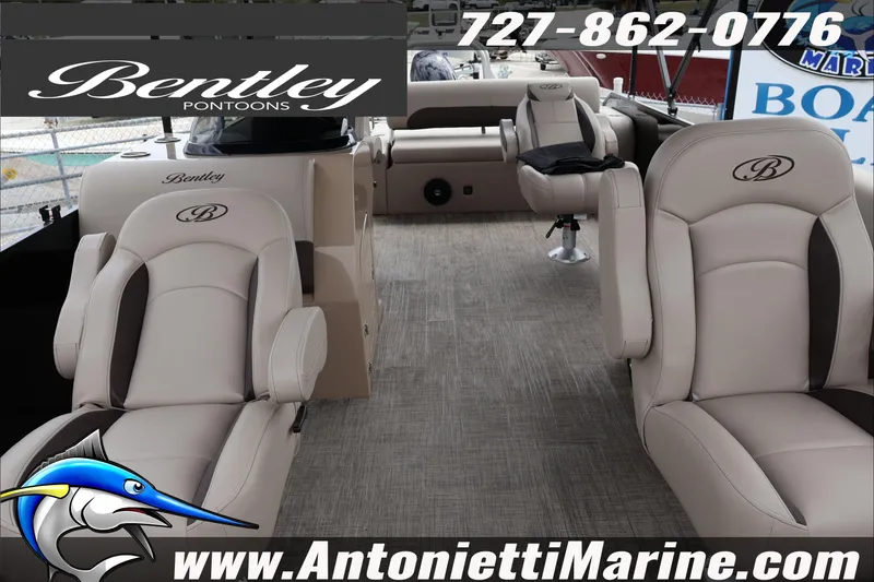 Slide: The Image of 2026 Bentley Pontoons Fish 243 Swingback interior with captain's chair and console. - 19