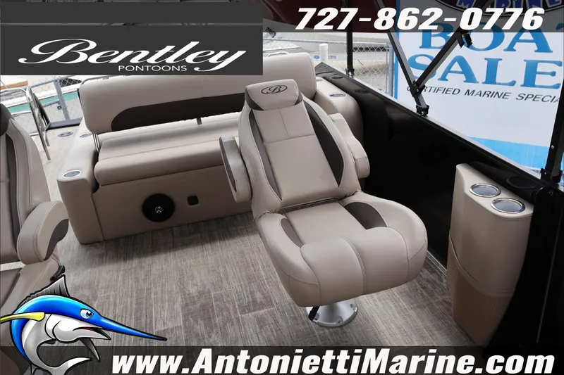 Slide: The Image of 2026 Bentley Pontoons Fish 243 Swingback dashboard with steering wheel and controls. - 21