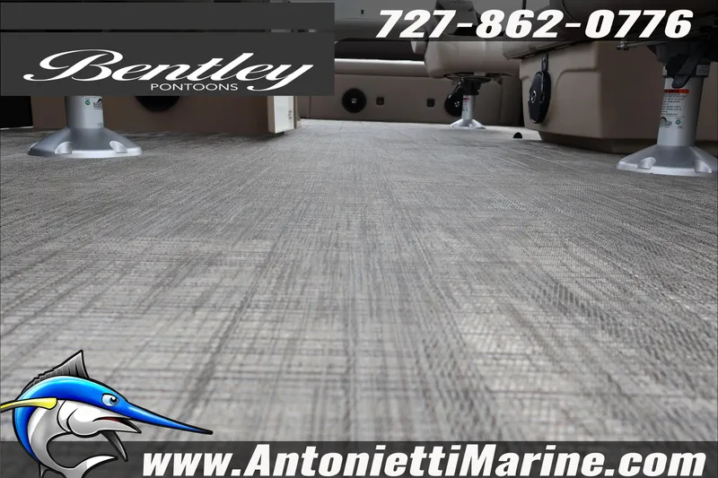 Slide: The Image of 2026 Bentley Pontoons Fish 243 Swingback console with cup holders and logo. - 9