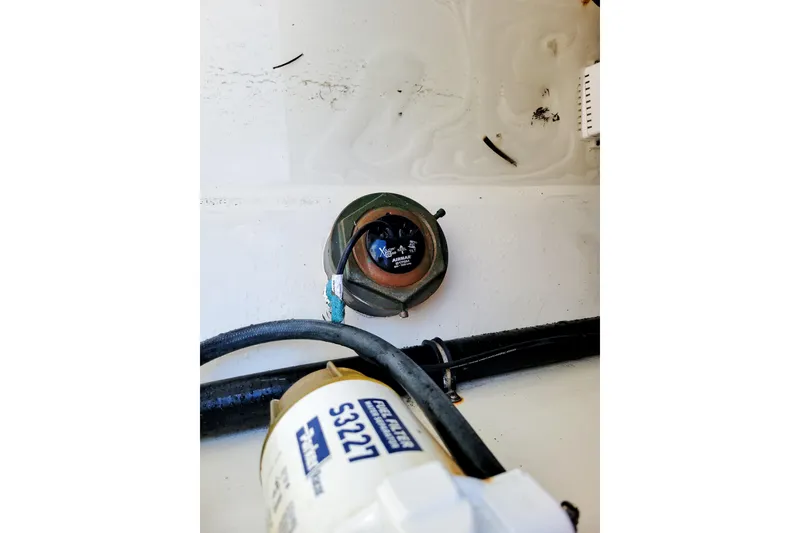 Slide: The Image of Storage compartment of 2021 Sea-Lion 27 CC boat with orange and black cases. - 17