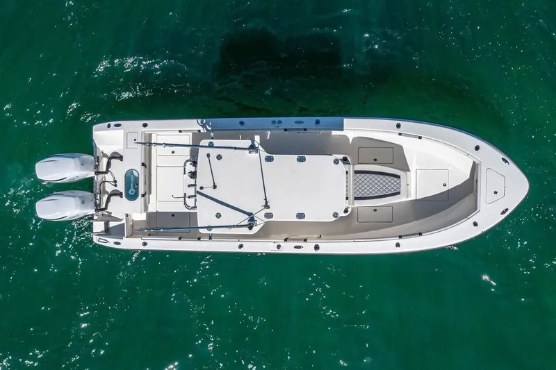 Slide: The Image of Top view of 2021 Sea-Lion 27 CC boat on clear green water. - 2