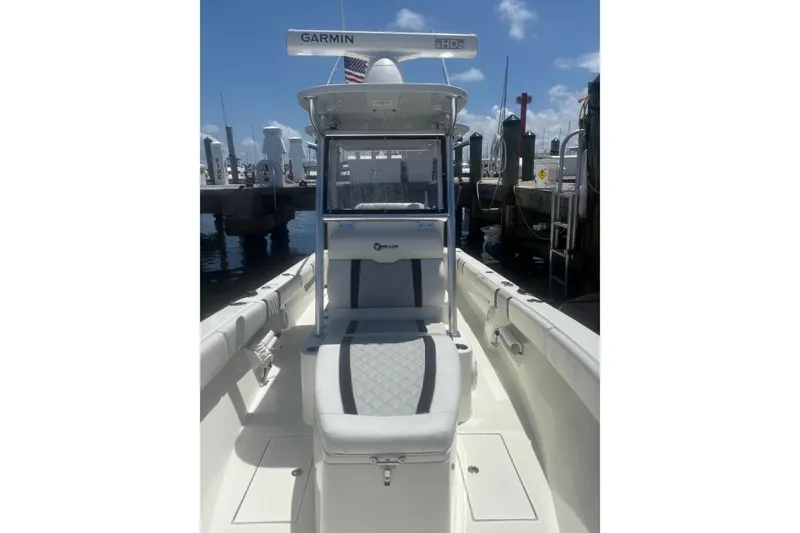 Slide: The Image of 2021 Sea-Lion 27 CC boat dashboard with navigation screens and steering wheel. - 5