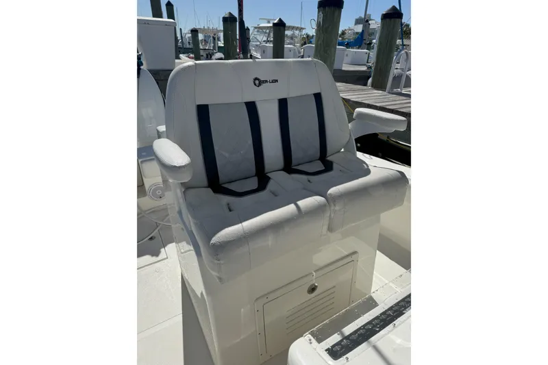 Slide: The Image of 2021 Sea-Lion 27 CC boat with dual engines docked at marina. - 9