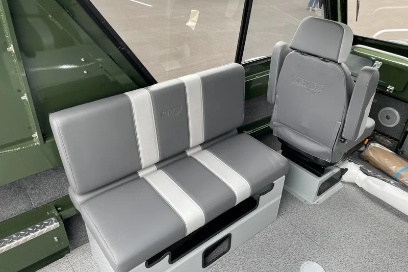 Slide: The Image of Interior of 2026 Hewescraft 210 Sea Runner ET HT with gray seating and steering console. - 13