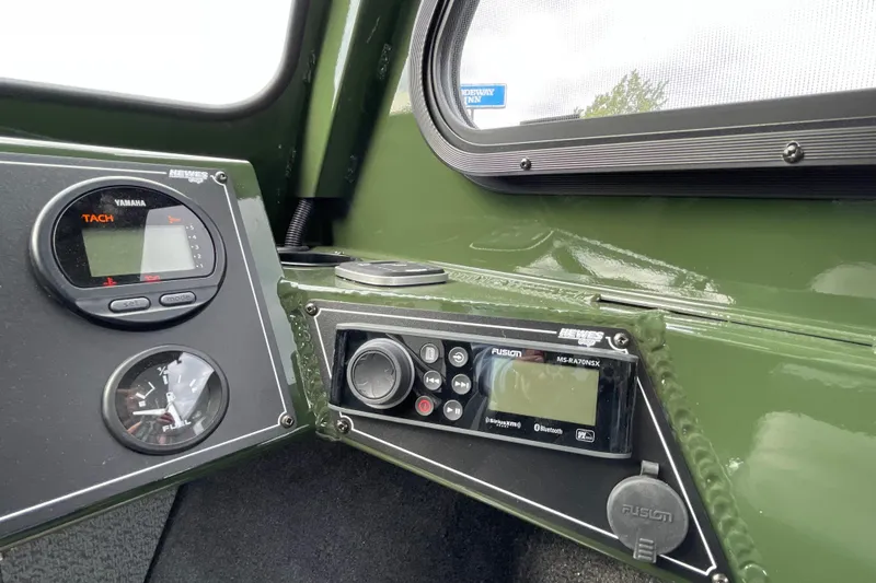 Slide: The Image of 2026 Hewescraft 210 Sea Runner ET HT dashboard with steering wheel and control panel. - 18