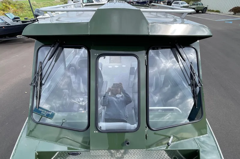 Slide: The Image of 2026 Hewescraft 210 Sea Runner ET HT boat bow with diamond plate flooring. - 21