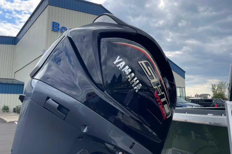 Slide: The Image of 2026 Hewescraft 210 Sea Runner ET HT boat with sleek design and branding. - 27