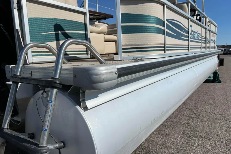 Slide: The Image of 2002 Premier 225 Majestic pontoon boat with ladder and seating, side view. - 11