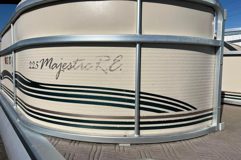 Slide: The Image of 2002 Premier 225 Majestic boat with decorative side panel design. - 14