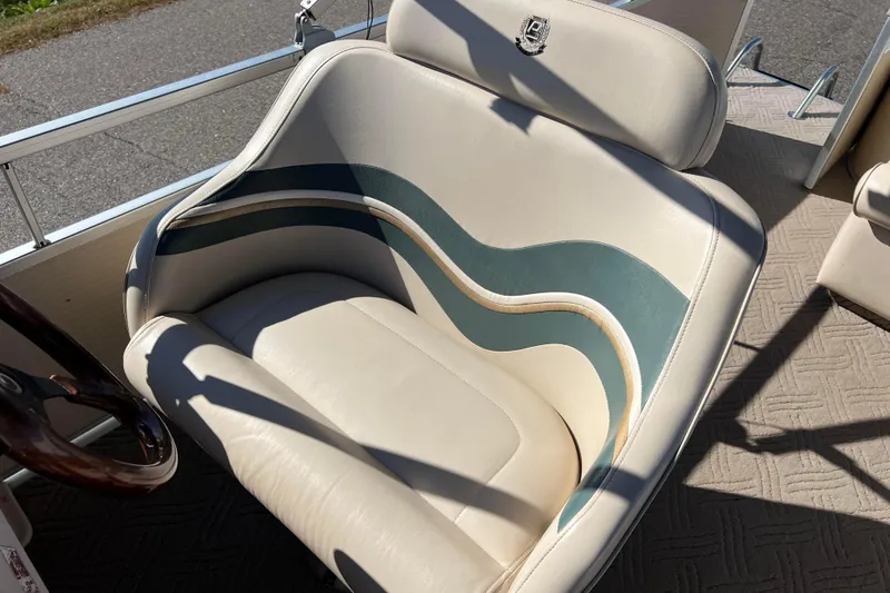 Slide: The Image of 2002 Premier 225 Majestic boat seat with elegant wave design and beige upholstery. - 23
