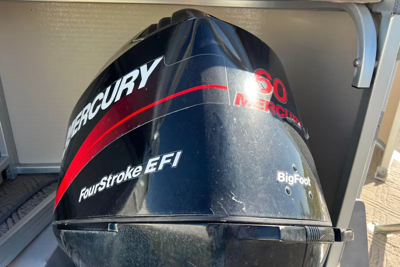 Slide: The Image of Mercury 60 BigFoot FourStroke EFI engine on 2002 Premier 225 Majestic boat. - 3