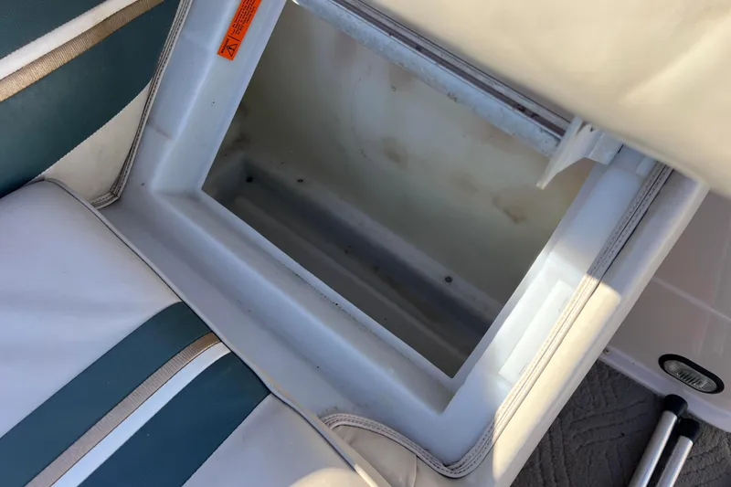 Slide: The Image of Open storage compartment in a 2002 Premier 225 Majestic boat seat. - 39