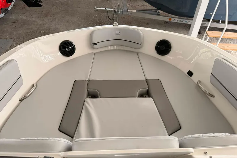 Slide: The Image of 2026 Bayliner VR6 Bowrider OB interior with cushioned seating and speakers. - 10