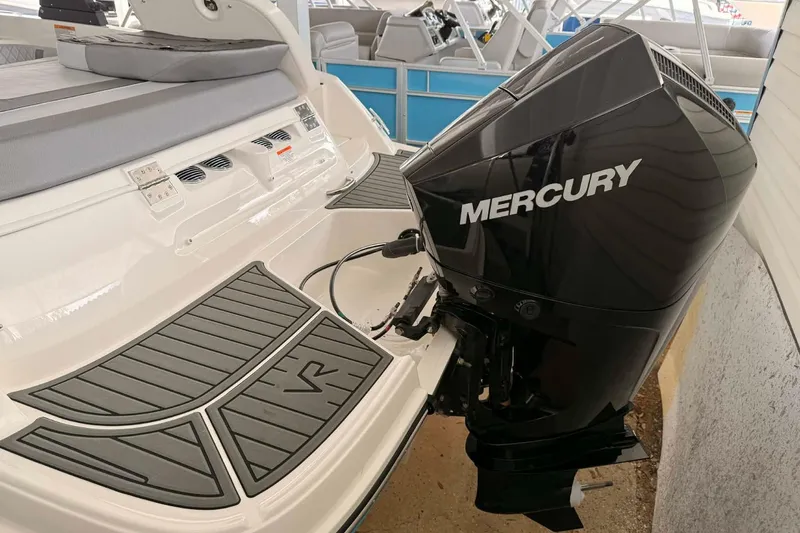 Slide: The Image of 2026 Bayliner VR6 Bowrider OB with Mercury outboard motor, rear view. - 11