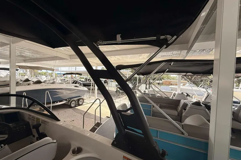 Slide: The Image of 2026 Bayliner VR6 Bowrider OB in showroom, featuring sleek design and modern interior. - 6