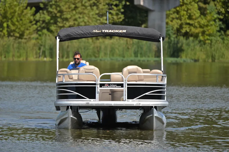 Slide: The Image of 2023 Sun Tracker Fishin' Barge 20 DLX on a serene lake. - 9