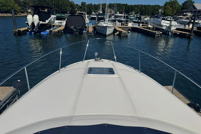 Slide: The Image of Bow view of 2005 Sea Ray 280 Sundancer docked at marina. - 11