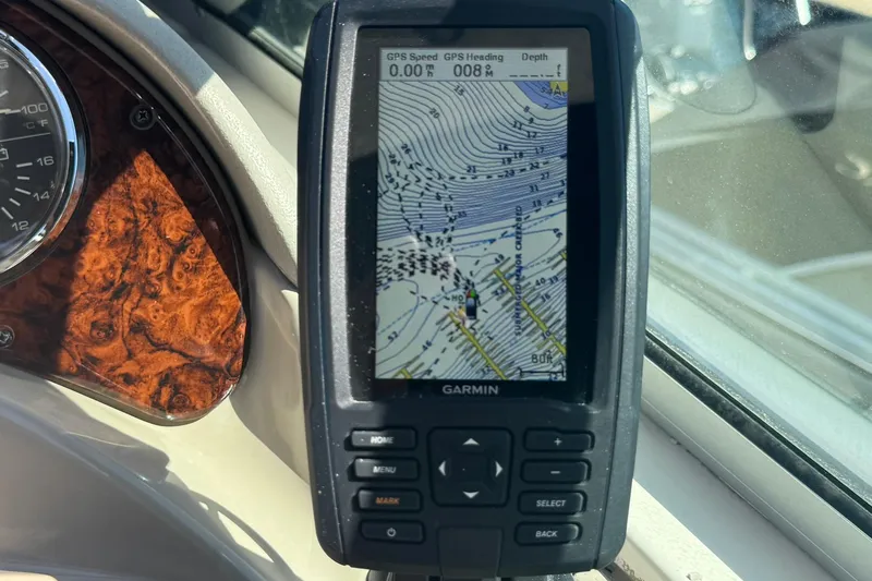 Slide: The Image of Garmin GPS on 2005 Sea Ray 280 Sundancer boat dashboard, displaying nautical map. - 18