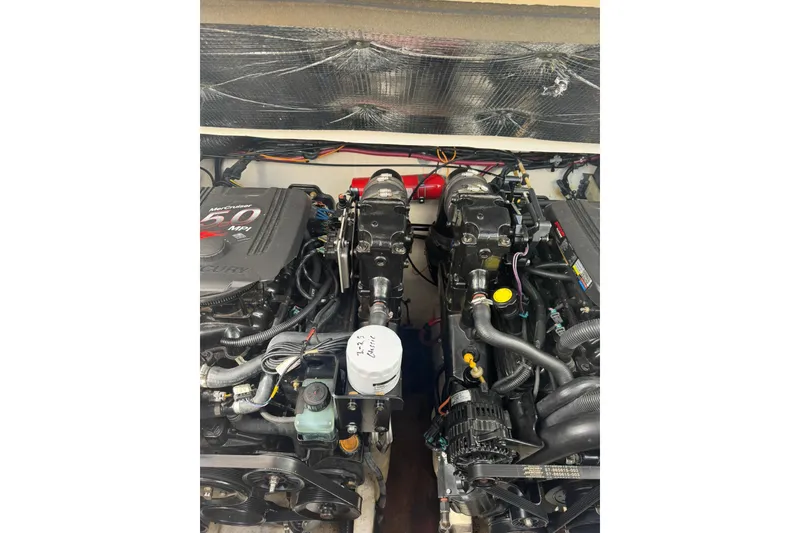 Slide: The Image of Engine compartment of a 2005 Sea Ray 280 Sundancer with dual MerCruiser 5.0 MPI engines. - 35