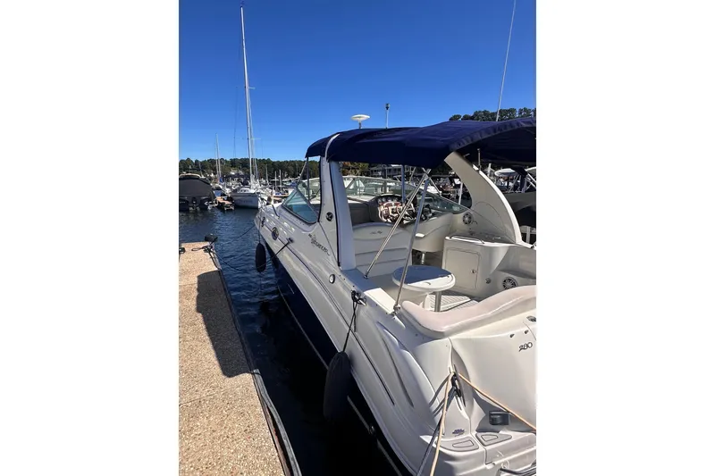 Slide: The Image of 2005 Sea Ray 280 Sundancer docked at marina under clear blue sky. - 6