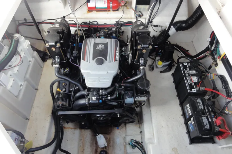 Slide: The Image of Engine compartment of 2010 Sea Ray 260 Sundancer with visible batteries and wiring. - 11