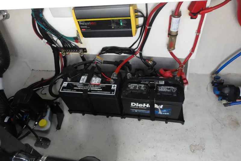 Slide: The Image of Engine compartment of 2010 Sea Ray 260 Sundancer with batteries and wiring. - 13