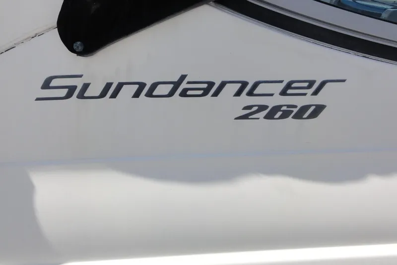 Slide: The Image of Sea Ray 260 Sundancer 2010 model nameplate on boat exterior. - 16