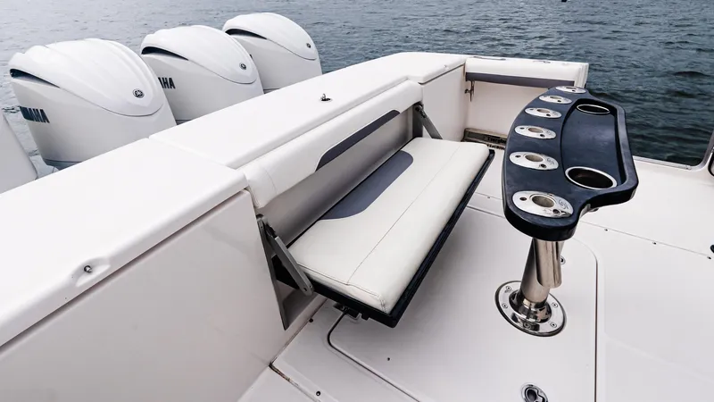 Slide: The Image of 2017 Everglades 435 CC boat with Yamaha engines and seating area on deck. - 17