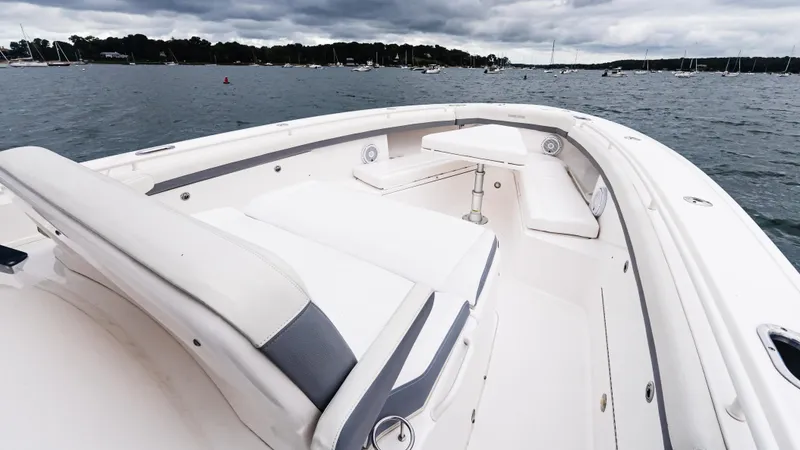 Slide: The Image of 2017 Everglades 435 CC boat with spacious seating on calm waters. - 42