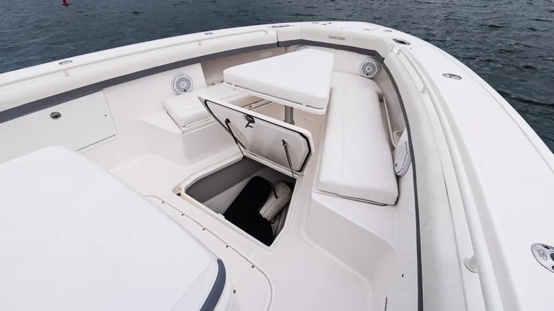 Slide: The Image of 2017 Everglades 435 CC boat interior with seating and storage compartment. - 44