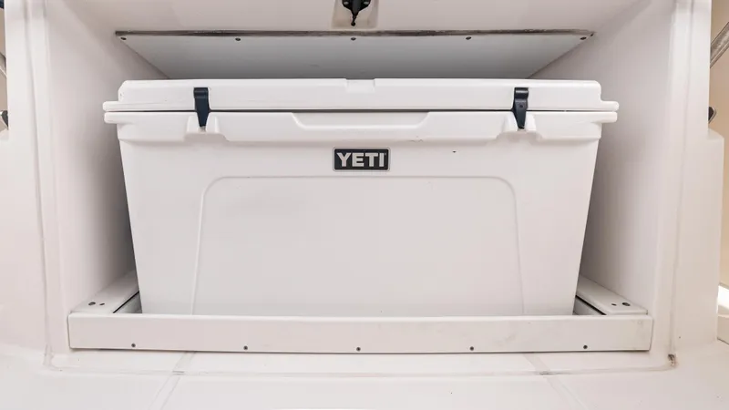 Slide: The Image of YETI cooler stored in 2017 Everglades 435 CC boat compartment. - 47