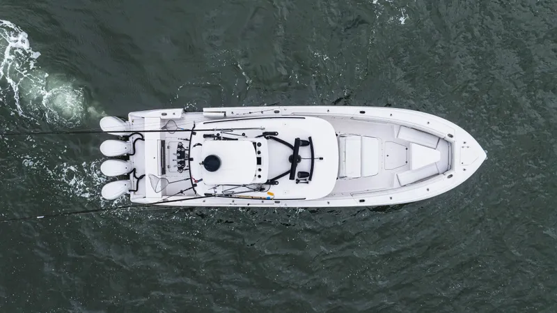 Slide: The Image of Overhead view of 2017 Everglades 435 CC boat navigating through water. - 8