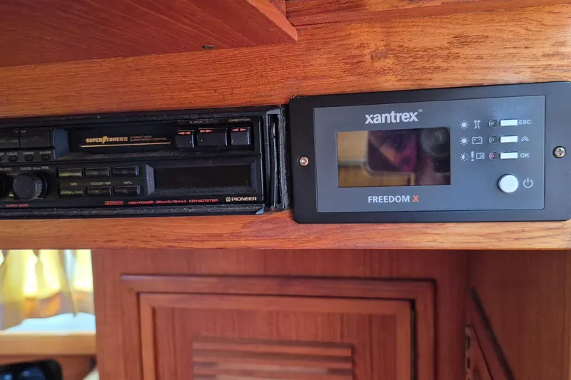 Slide: The Image of Control panel and radio in 1990 Sabreline 36 Fast Trawler boat interior. - 43