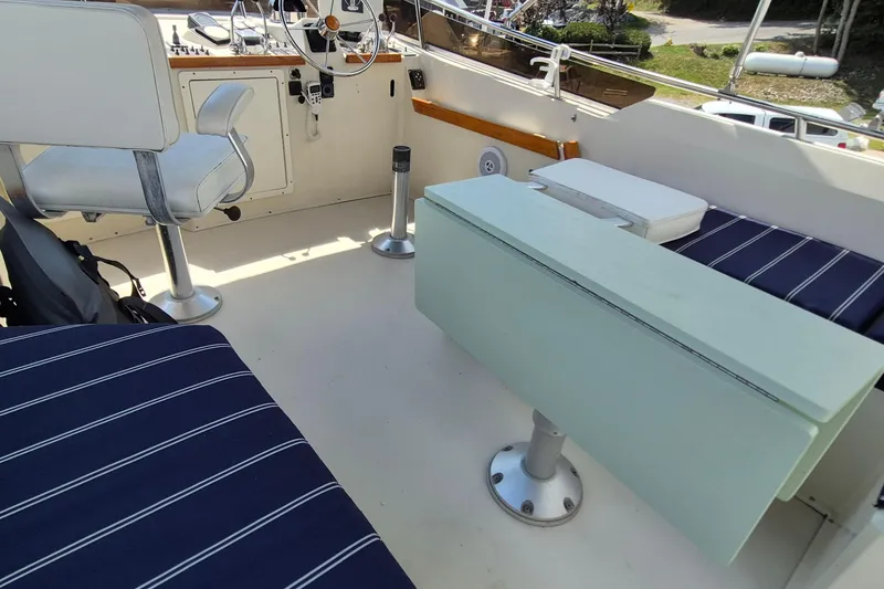 Slide: The Image of Interior of 1990 Sabreline 36 Fast Trawler with seating and helm station. - 58