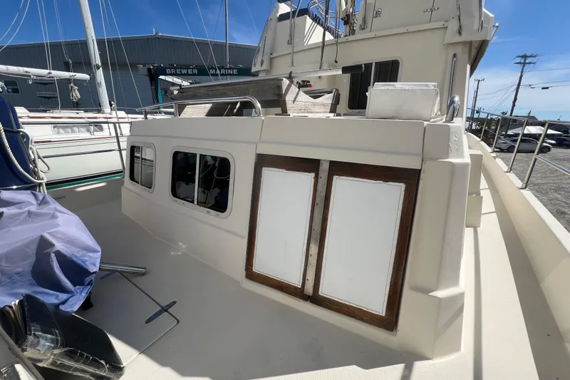 Slide: The Image of 1990 Sabreline 36 Fast Trawler deck view with cabin and railing details. - 68