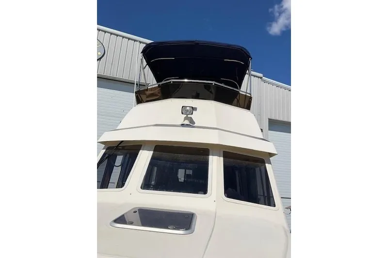 Slide: The Image of 1990 Sabreline 36 Fast Trawler, docked with blue sky background. - 71