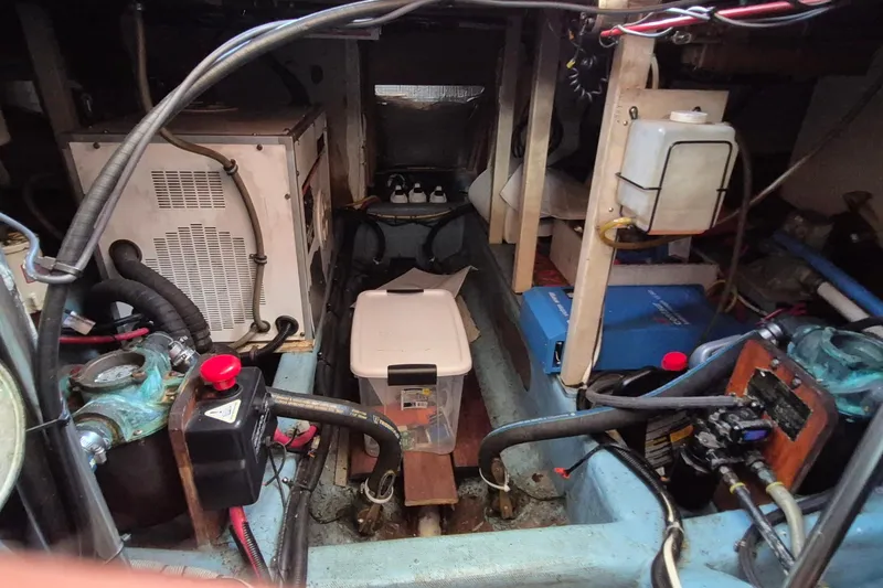 Slide: The Image of Engine room of 1990 Sabreline 36 Fast Trawler with various mechanical components. - 82