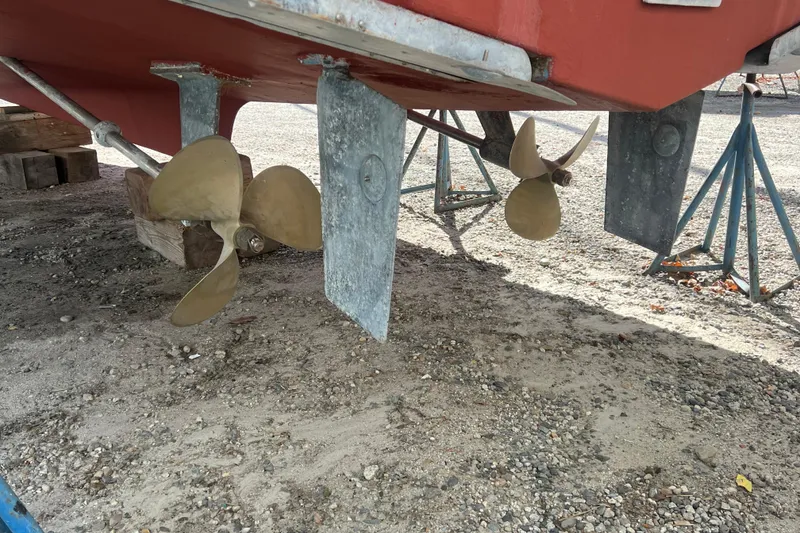 Slide: The Image of 1990 Sabreline 36 Fast Trawler propellers and rudders on dry dock. - 88