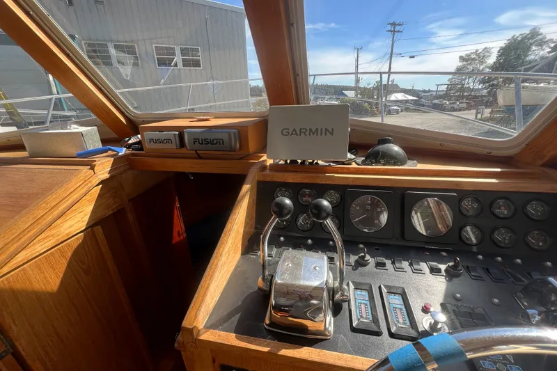Slide: The Image of 1990 Sabreline 36 Fast Trawler helm with Garmin navigation and Fusion audio system. - 14
