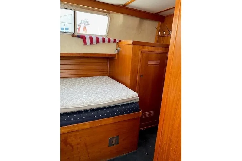 Slide: The Image of Cozy cabin interior of 1990 Sabreline 36 Fast Trawler with wooden furnishings. - 31