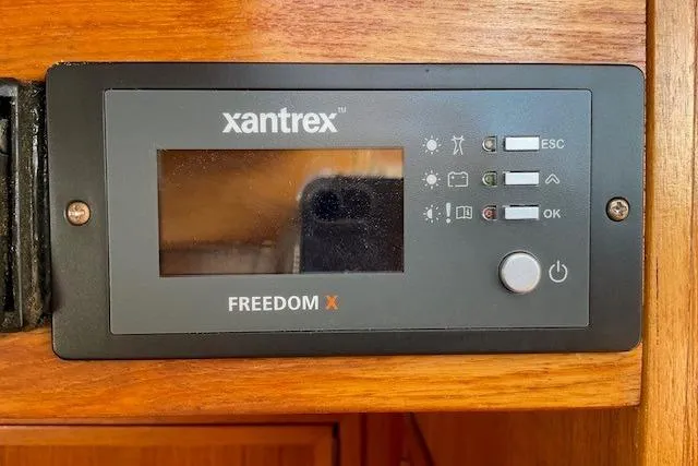 Slide: The Image of Xantrex Freedom X control panel on 1990 Sabreline 36 Fast Trawler boat. - 39