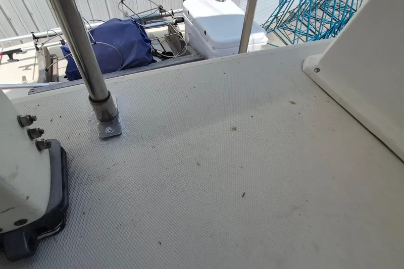 Slide: The Image of Deck view of 1990 Sabreline 36 Fast Trawler with railing and equipment. - 50