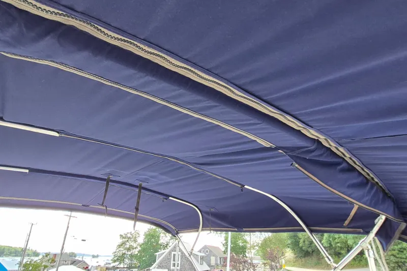 Slide: The Image of Blue canopy of a 1990 Sabreline 36 Fast Trawler, showing metal support structure. - 51