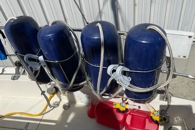 Slide: The Image of Four blue fenders secured on a 1990 Sabreline 36 Fast Trawler deck. - 67