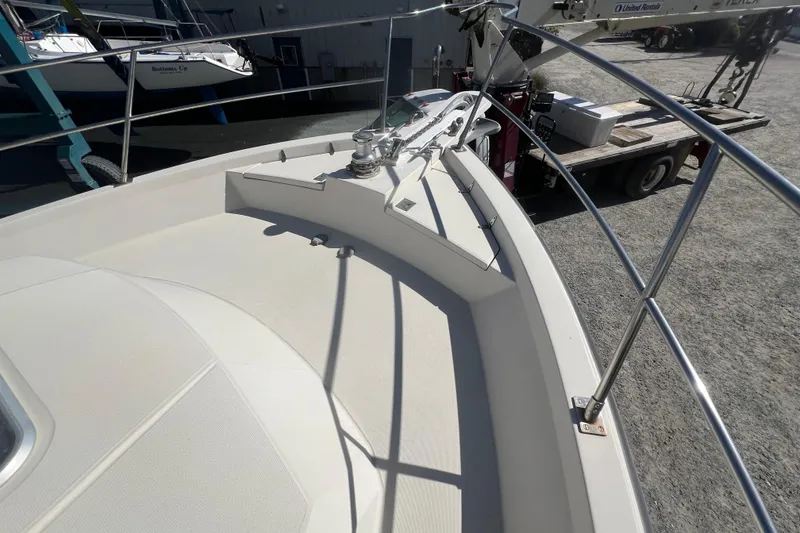 Slide: The Image of 1990 Sabreline 36 Fast Trawler bow with railing and anchor equipment. - 70