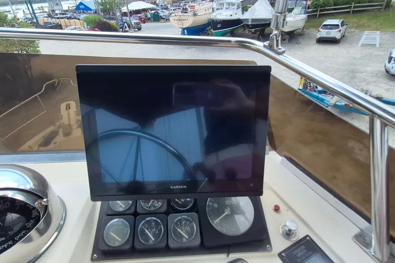Slide: The Image of 1990 Sabreline 36 Fast Trawler helm with Garmin display and gauges. - 77