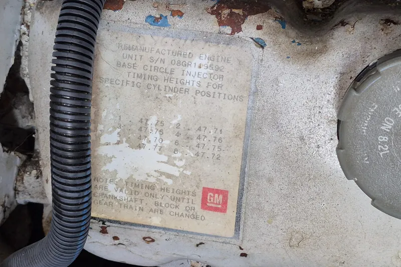 Slide: The Image of Engine label on 1990 Sabreline 36 Fast Trawler, showing timing heights and GM logo. - 84